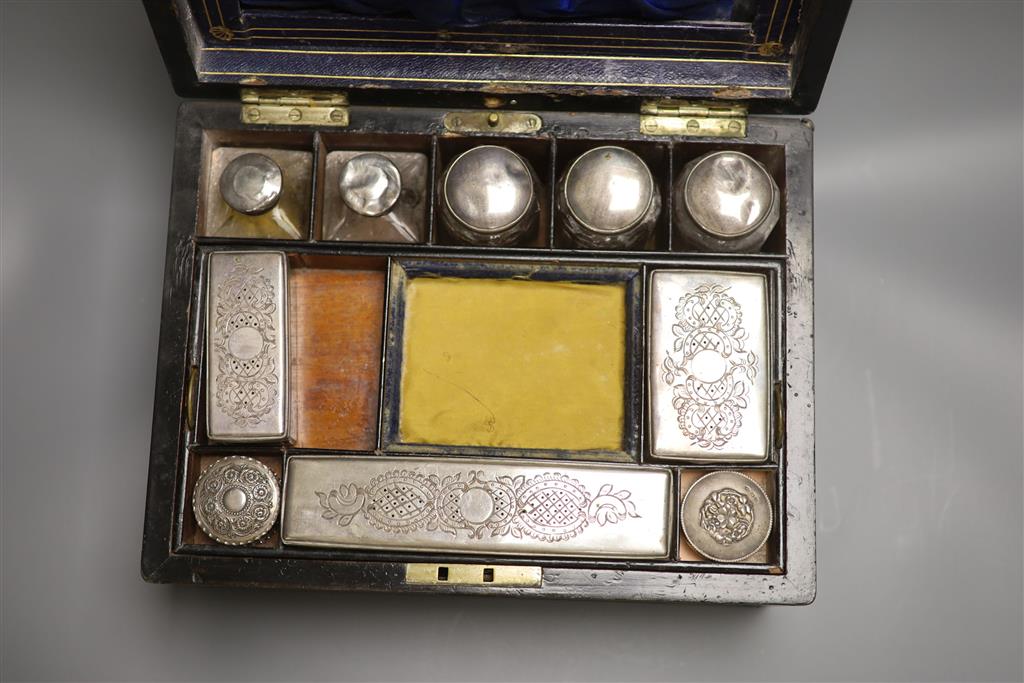 A 19th century brass bound coromandel fitted vanity case and contents, length 31cm